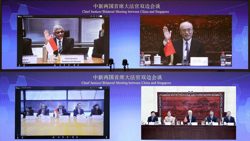 张军与新加坡最高法院首席大法官梅达顺举...